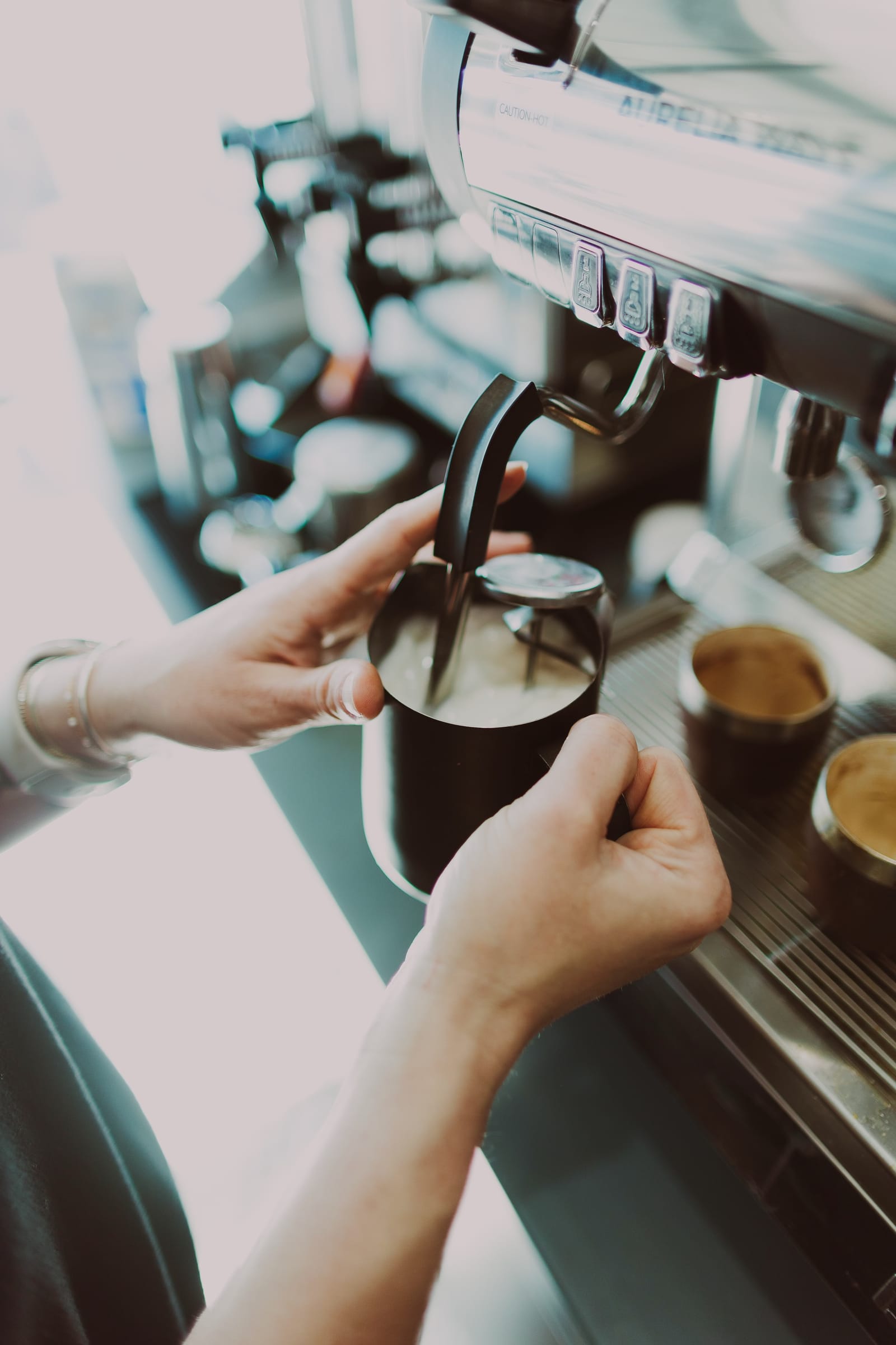 A craft latte being poured at the Be Free Café coffee bar